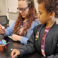 parent and child building a solar bug at Energizing Our Weekend